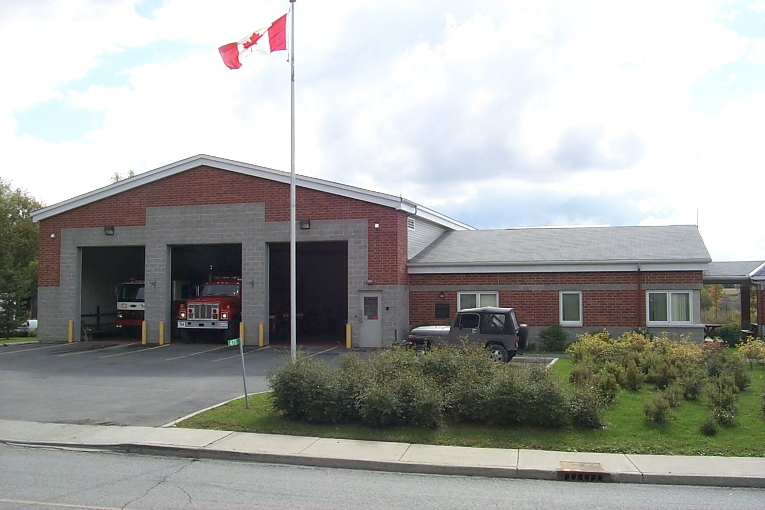 Exterior view of the rural red-brick City of Ottawa Fire Station 64.